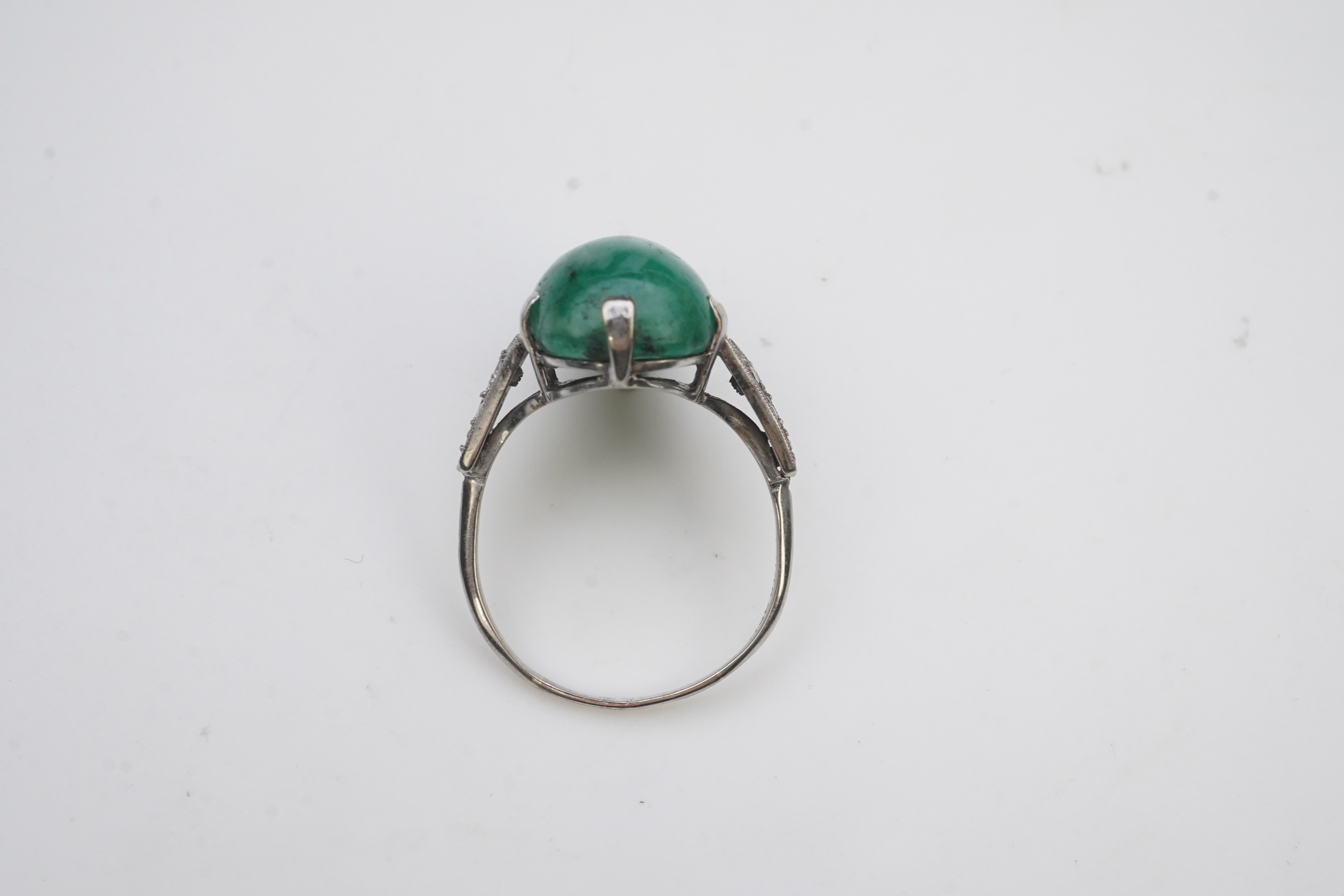 An emerald and diamond ring, early 20th century